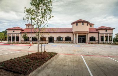 A wide shot of a commercial building with a new roof