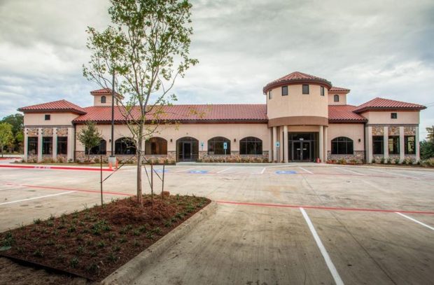 A wide shot of a commercial building with a new roof